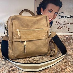 Tan backpack, lots of pockets and storage ***used once